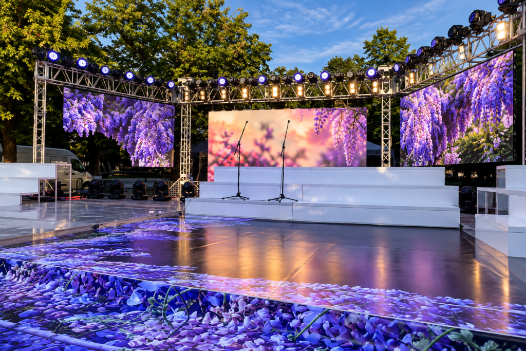 empty floral concert stage at sunset