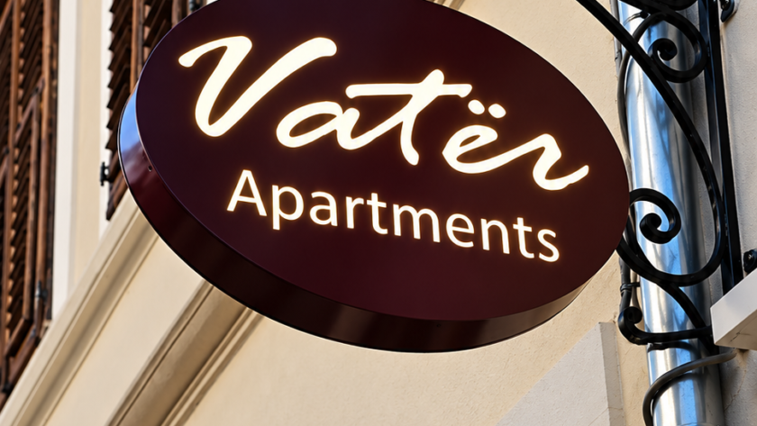 vatër apartments facade sign