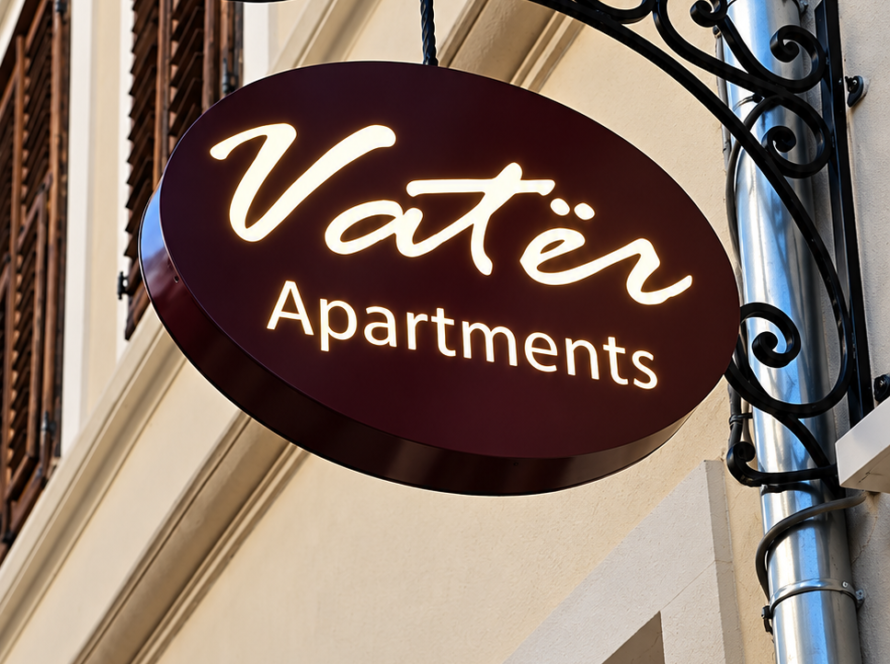 vatër apartments facade sign